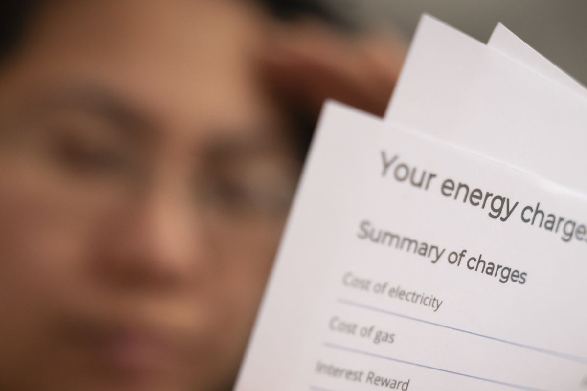 Person looking at energy charges