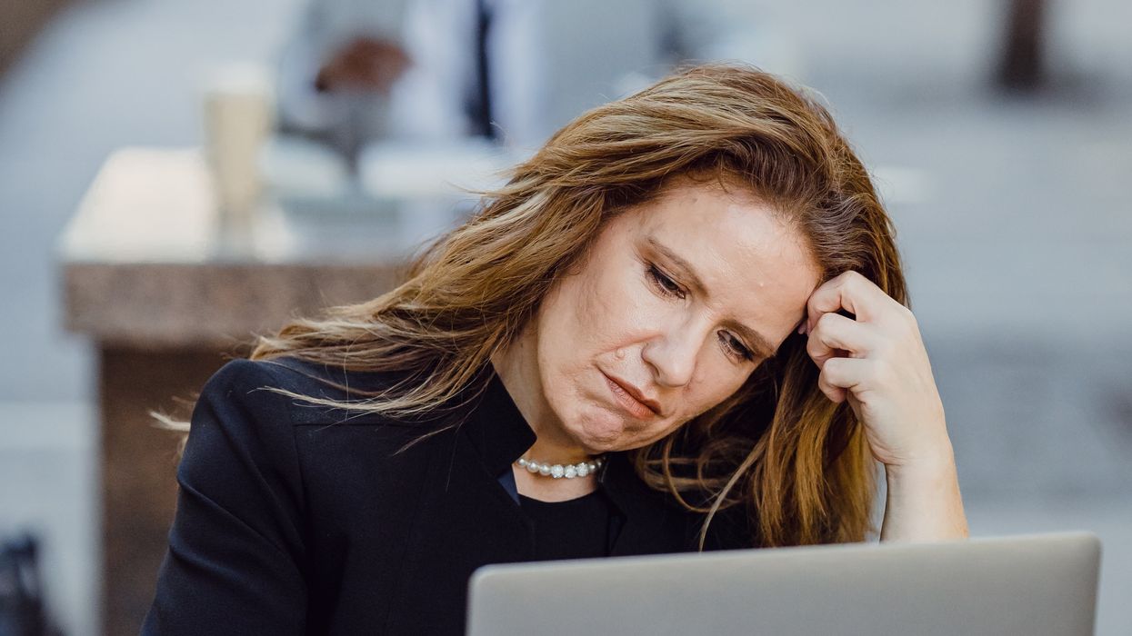 Person looking at pension savings on laptop