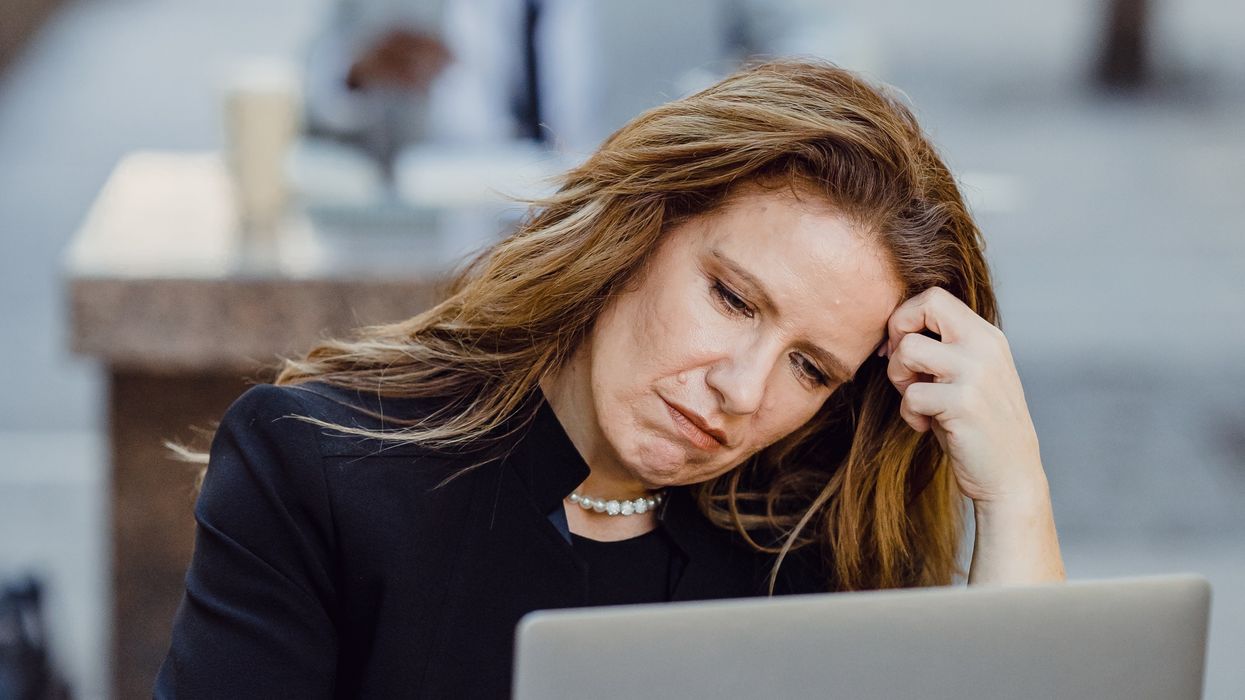 Person looking at pension savings on laptop