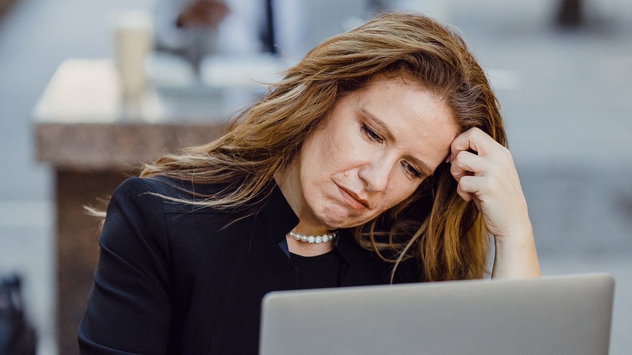 Person looking at pension savings on laptop