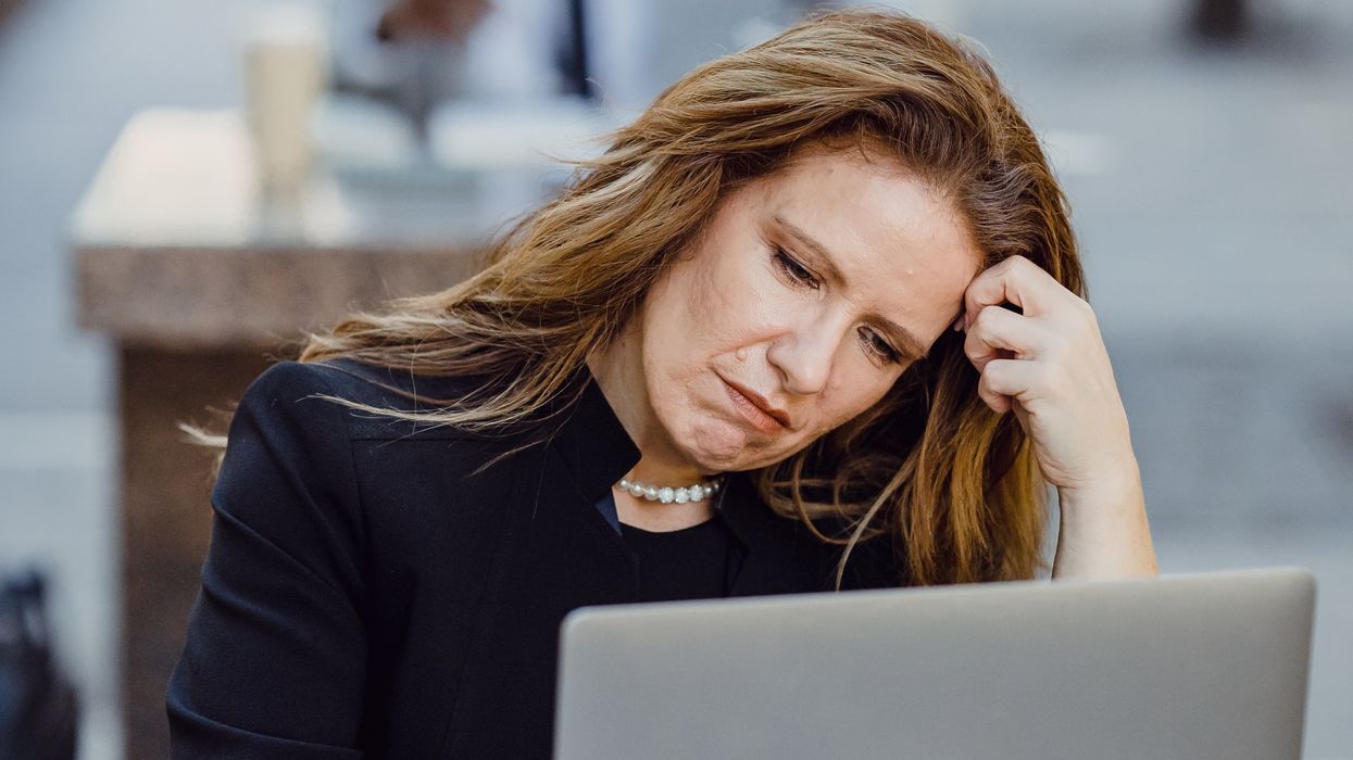 Person looking at pension savings on laptop