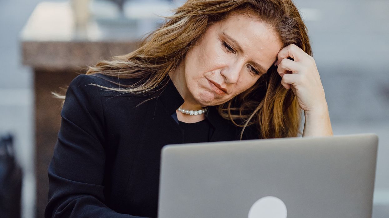 Person looking at pension savings on laptop