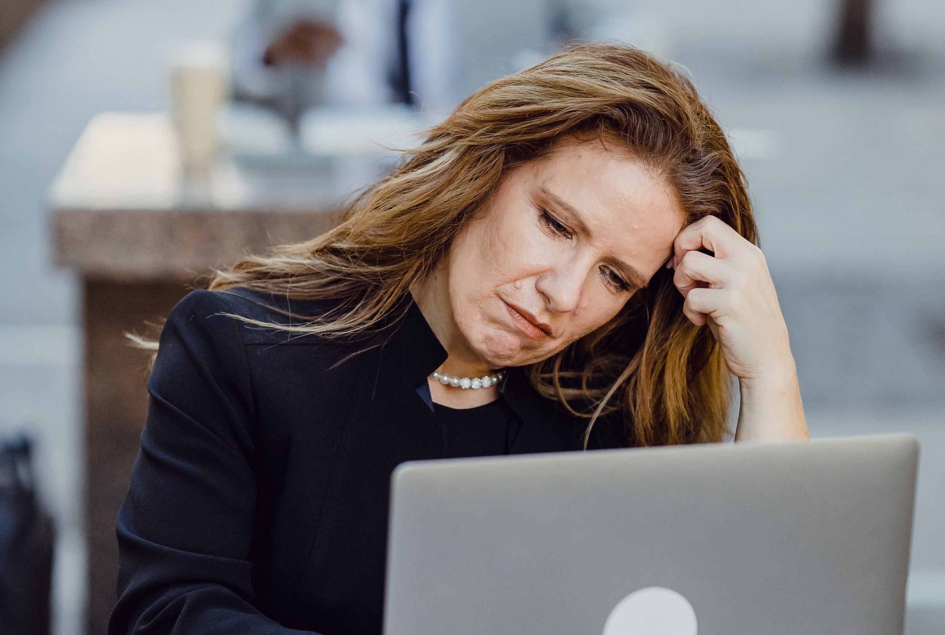 Person looking at pension savings on laptop