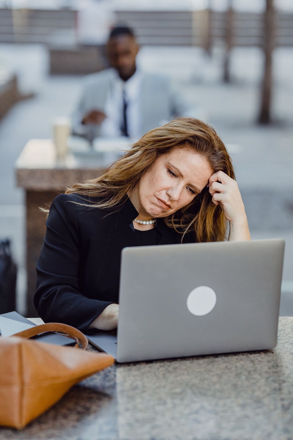Person looking at pension savings on laptop