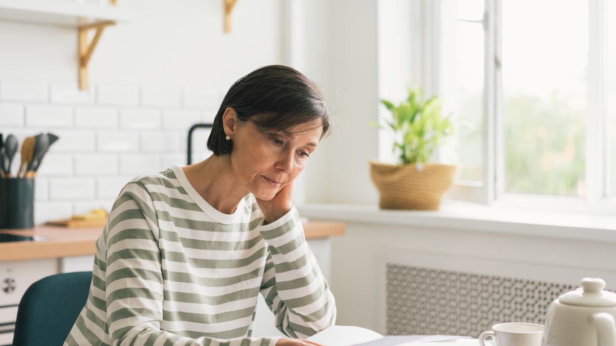 Person looks at bills