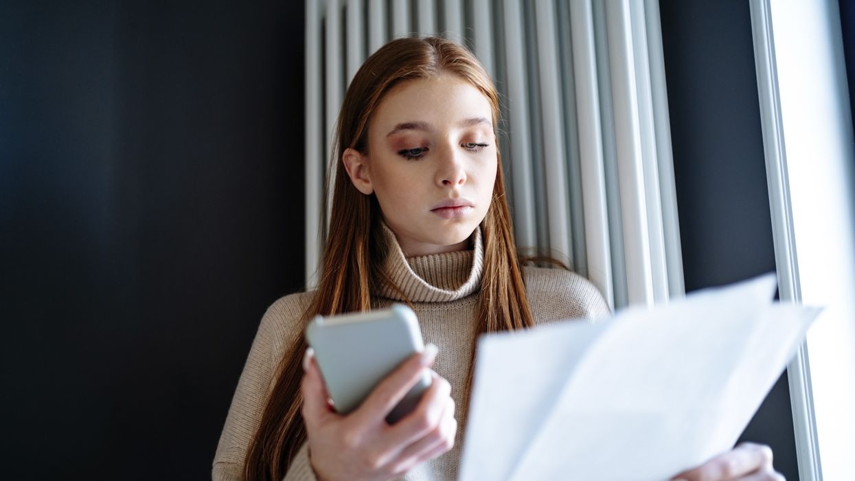 Person looks at energy bills