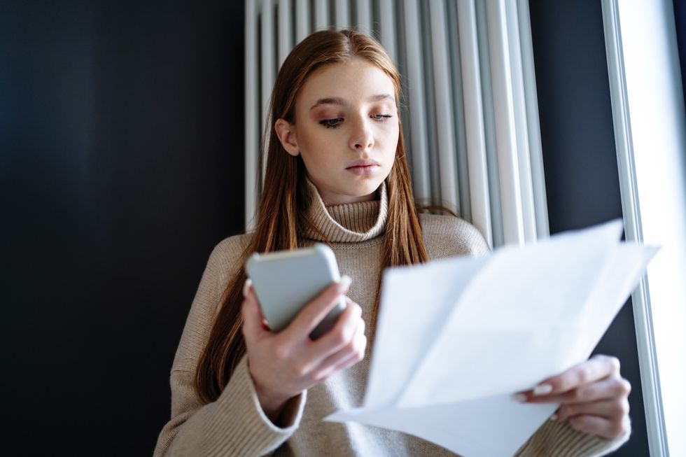 Person looks at energy bills