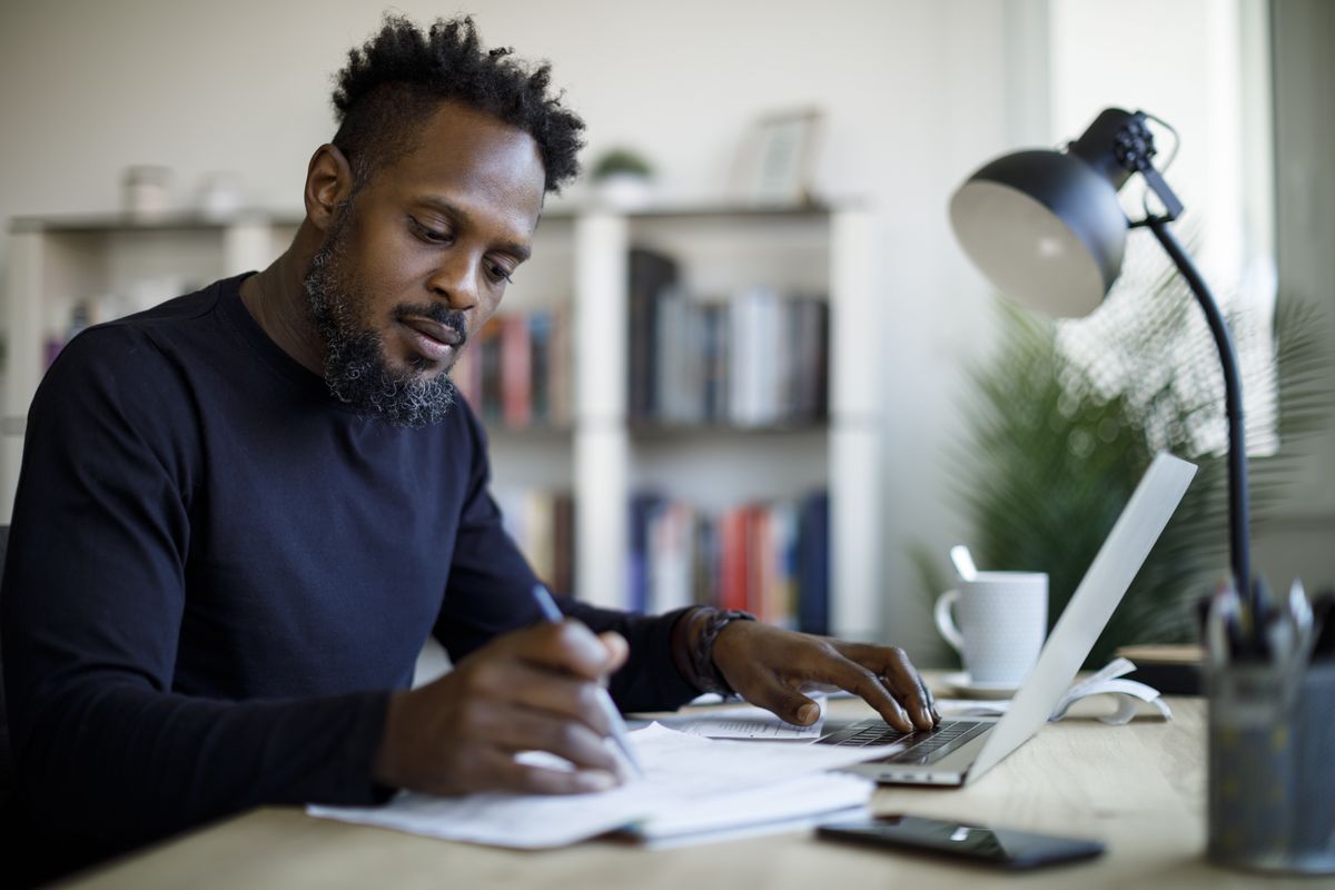 Person looks at finances at desk