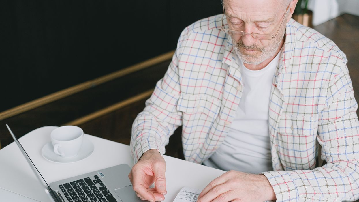 Person looks at financial documents
