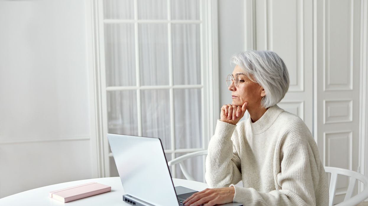 Person looks at laptop to get state pension forecast
