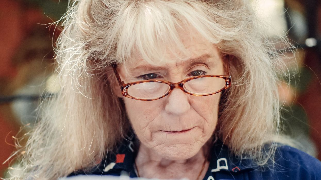 Person looks at letter