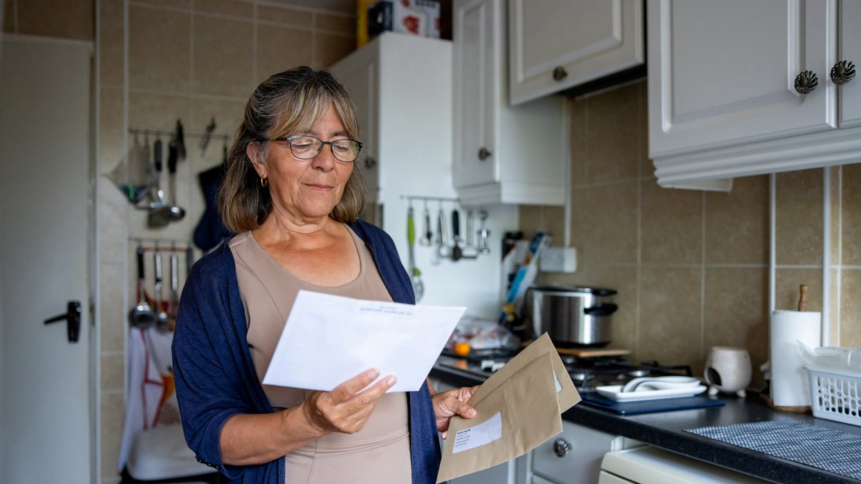 Person looks at letter