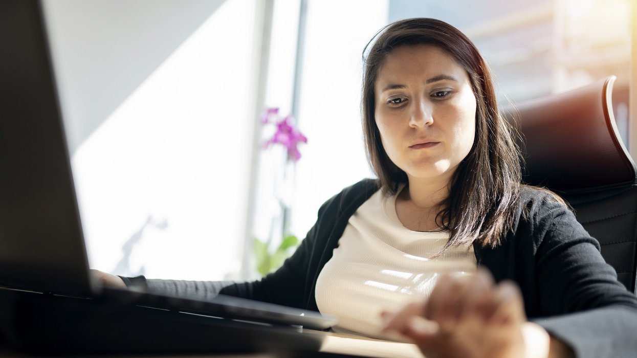 Person looks at pay slip