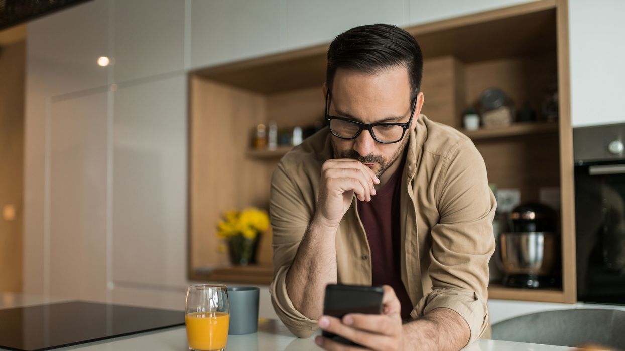 Person looks at phone