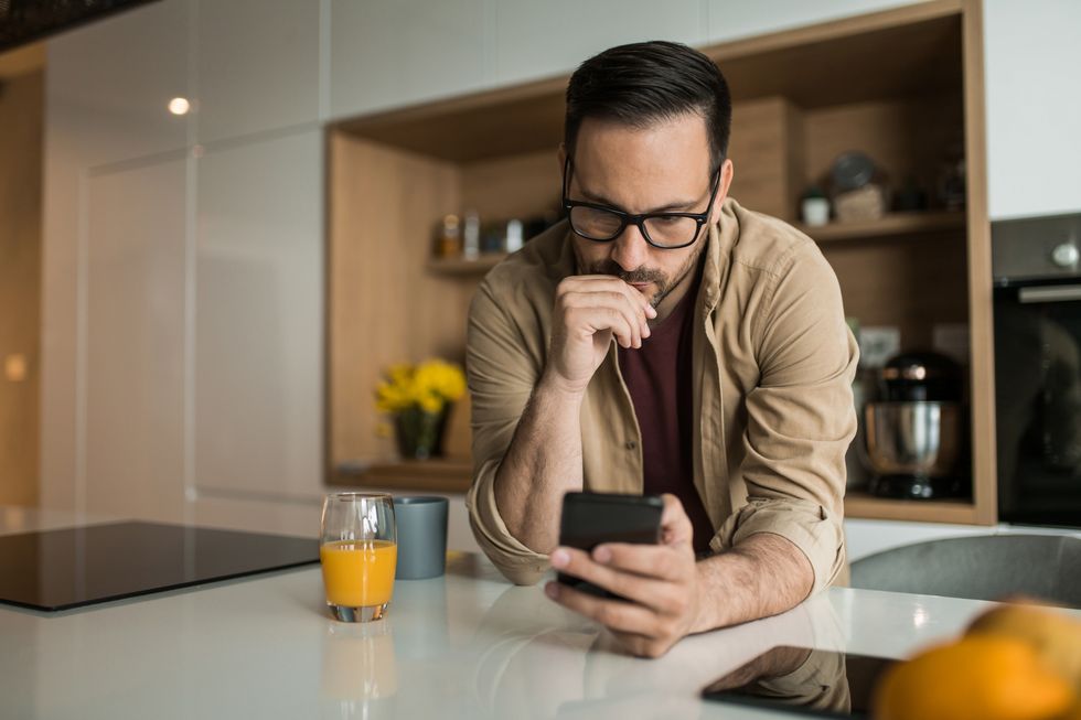 Person looks at phone