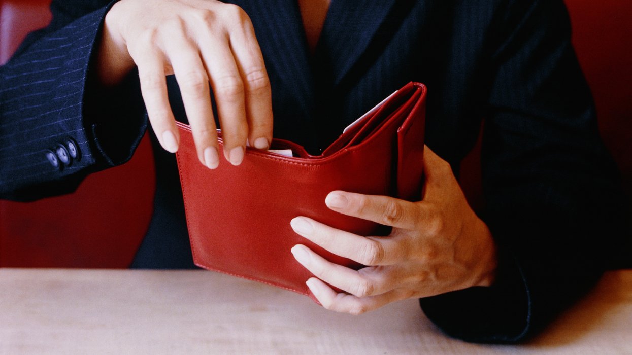 Person looks at wallet