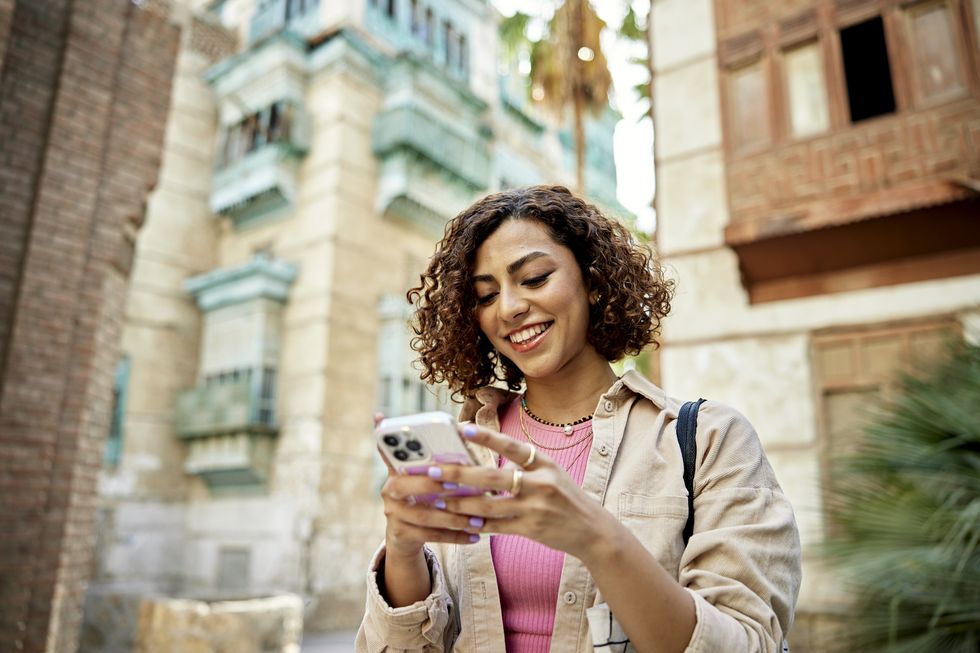 Person looks happy at phone