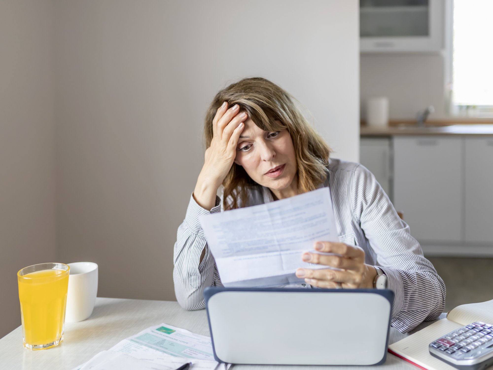 Person looks worried about finances