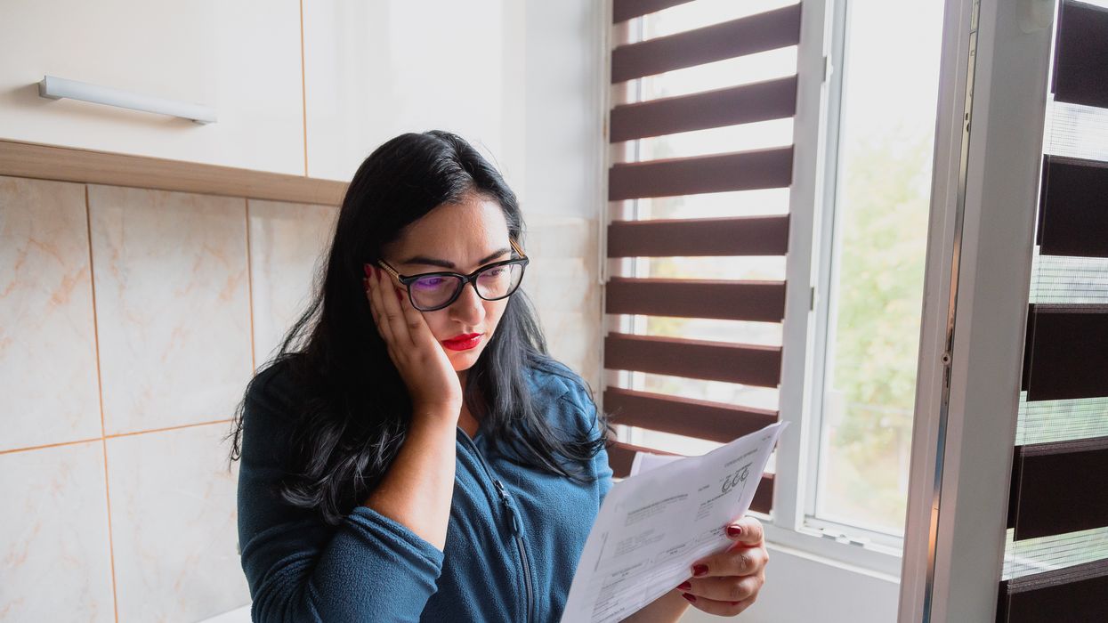 Person looks worried at energy bills