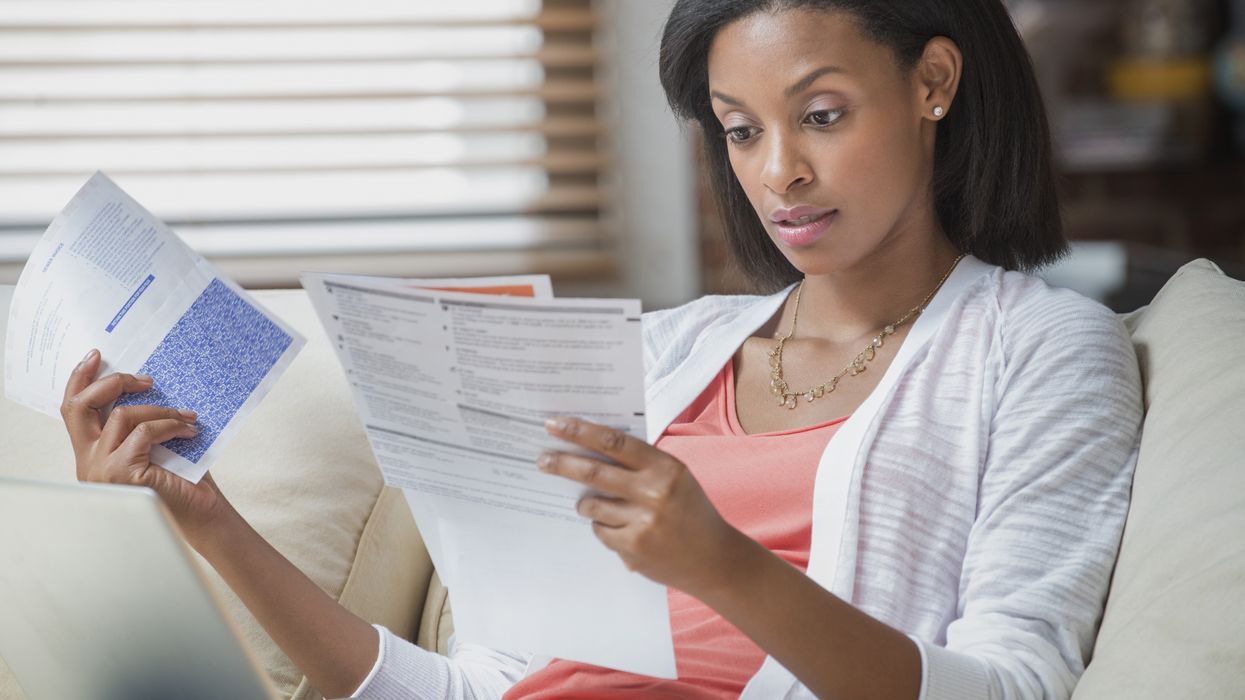 Person looks worried at water bill statement