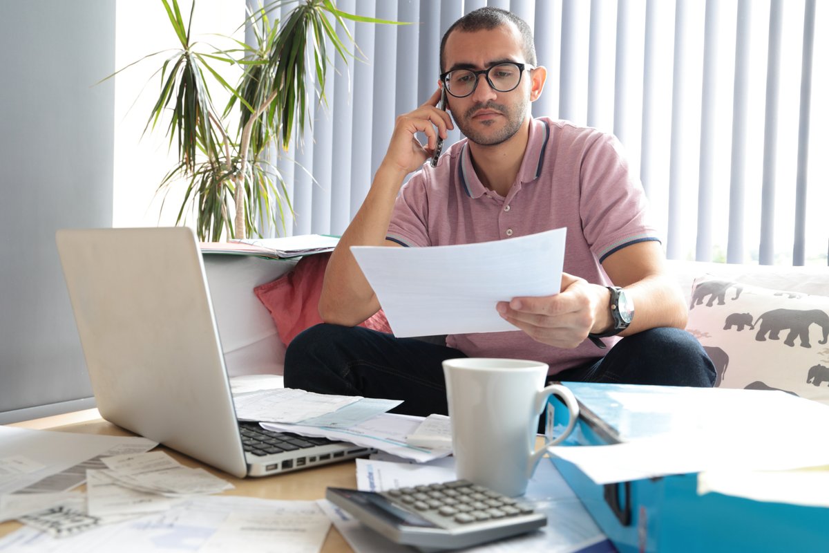 Person looks worried at water bill statement