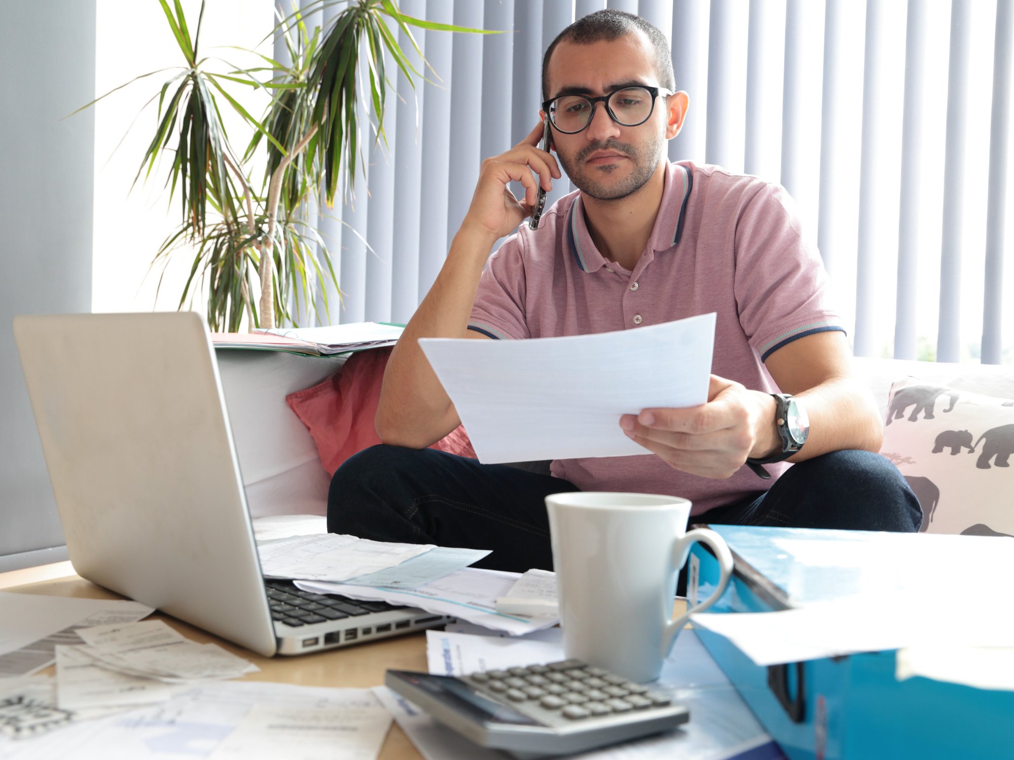 Person looks worried at water bill statement
