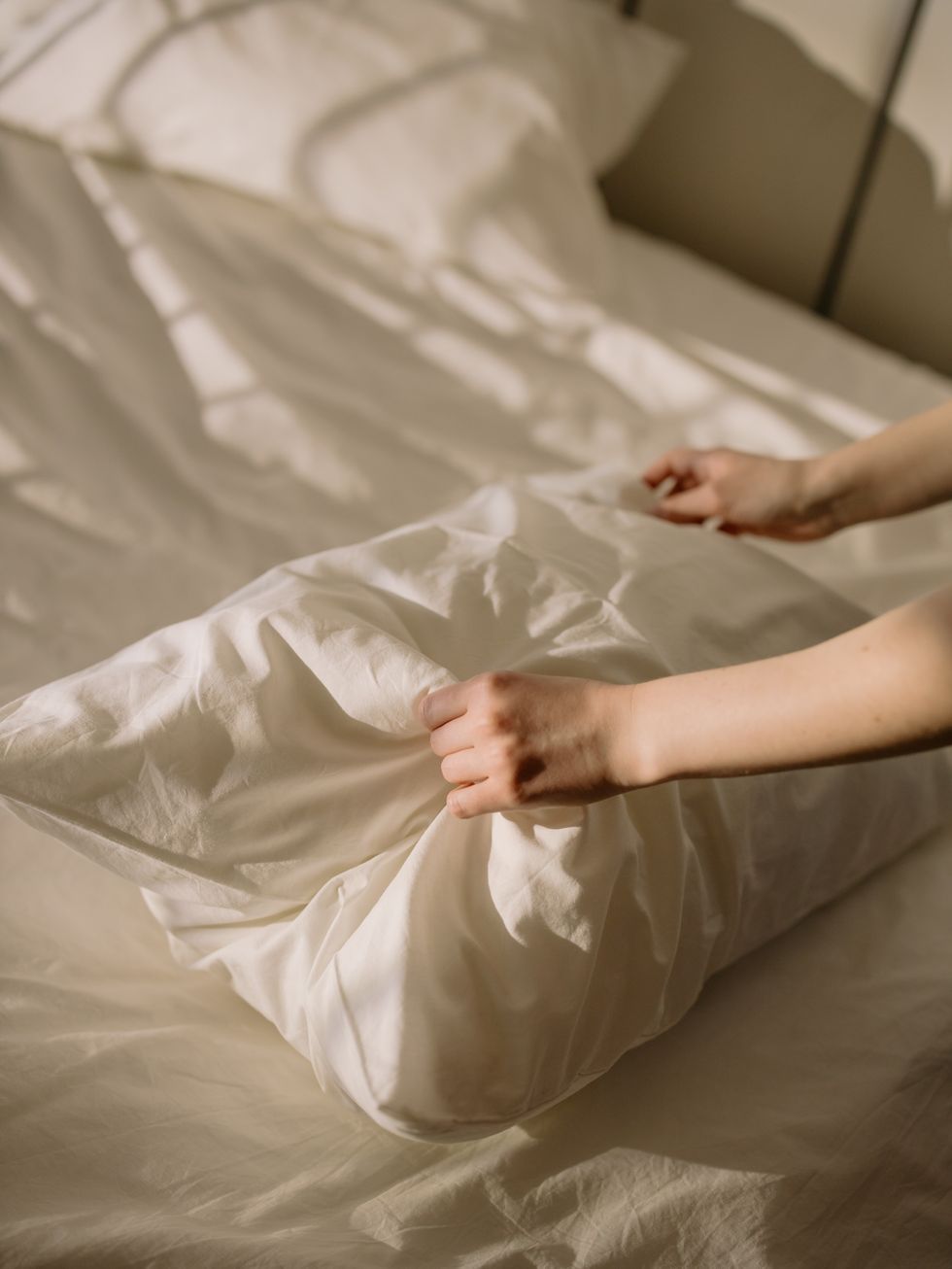Person making bed