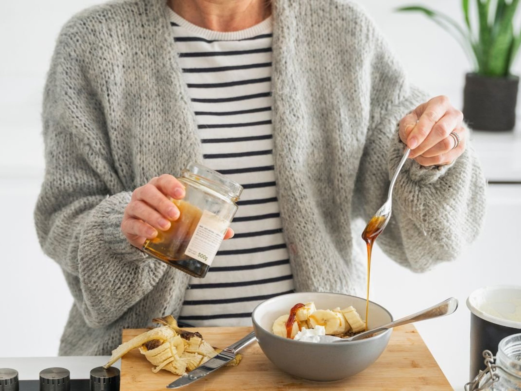 PERSON MAKING BREAKFAST