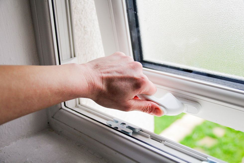 Person opening bathroom window