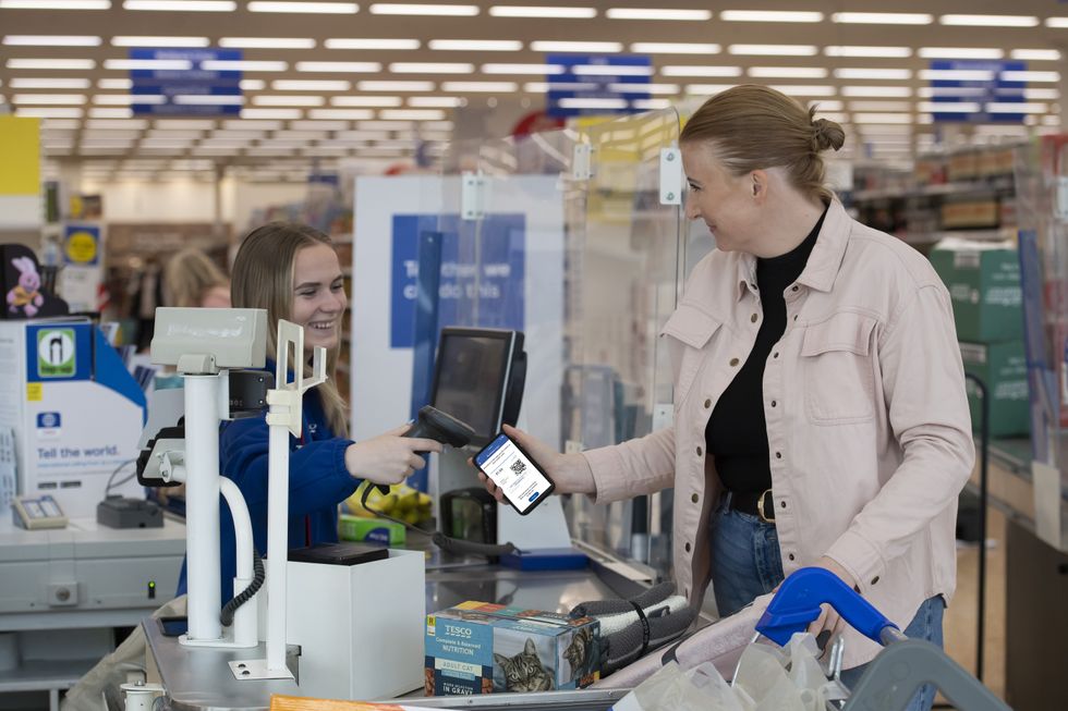 Person scanning a Tesco Clubcard