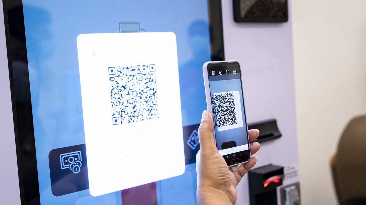 Person scanning QR code