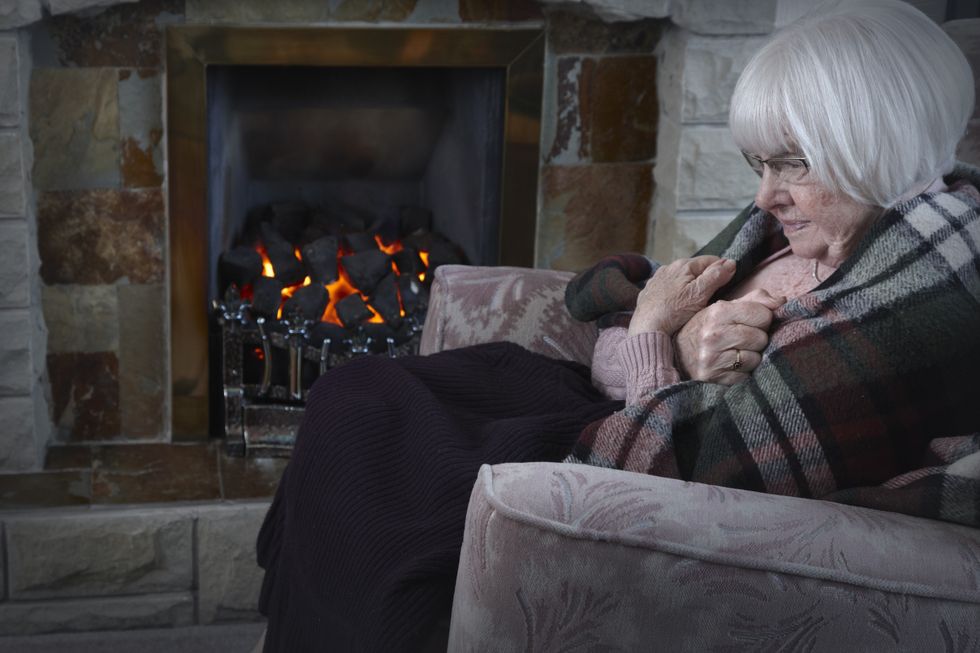 Person shivers at home