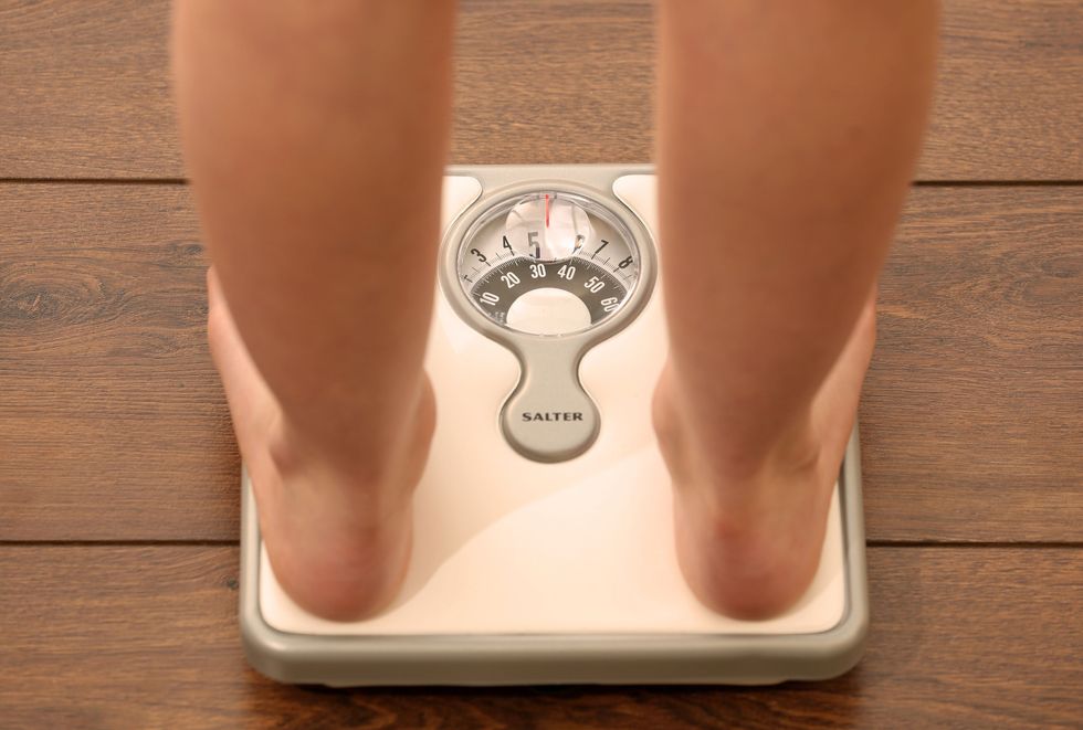 person standing on scale