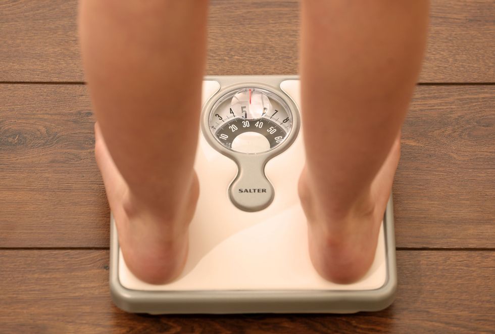 person standing on scales