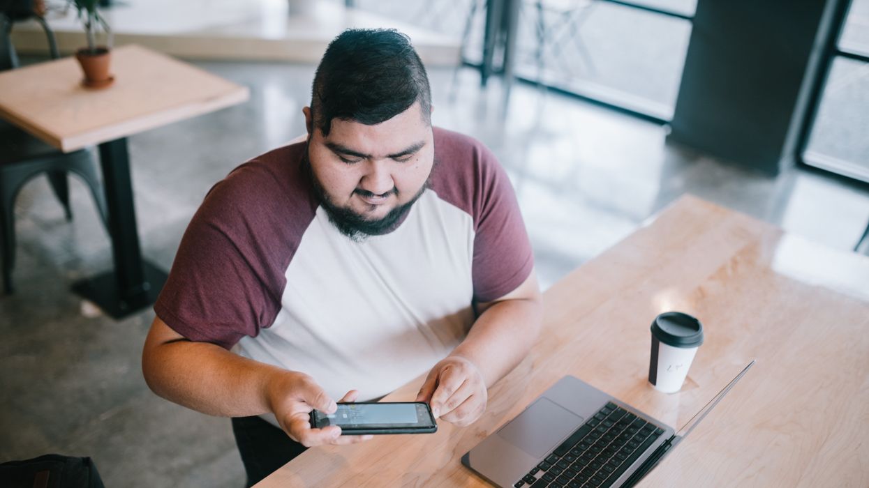Person takes photo of their pay slip