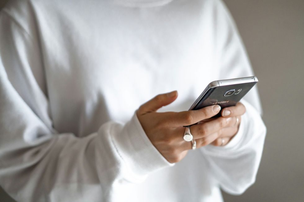 Person texting on Android mobile