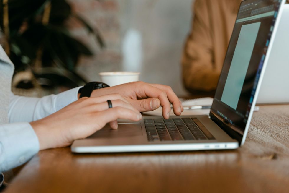 Person typing on a laptop