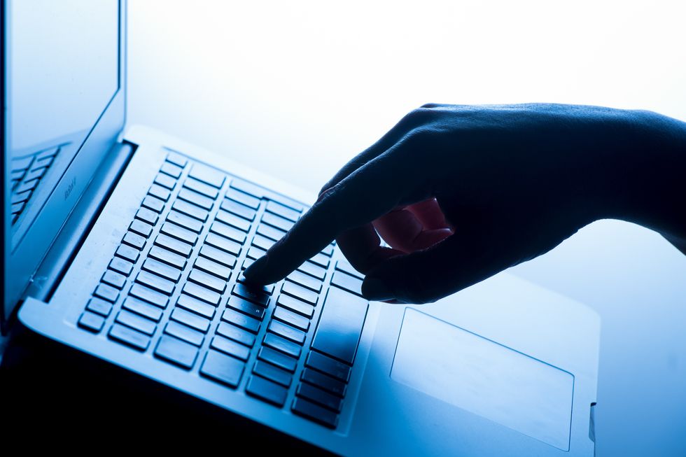 Person typing on laptop