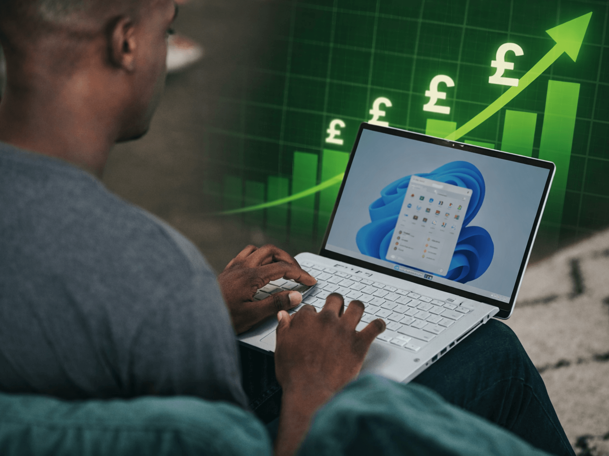 Person typing on Windows 11 laptop with price chart in background