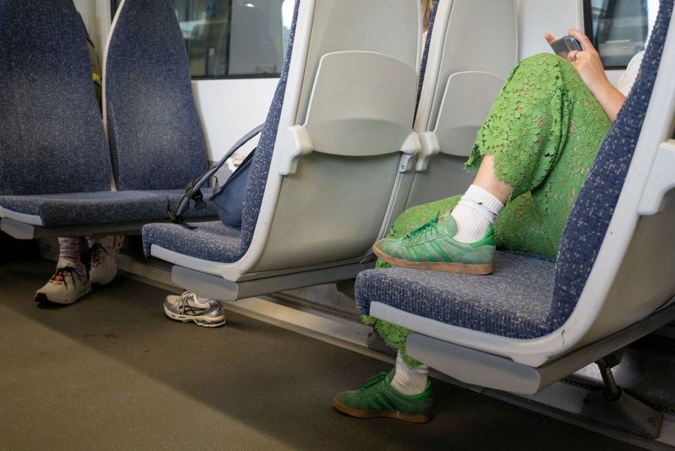 Person with feet on a train (stock)