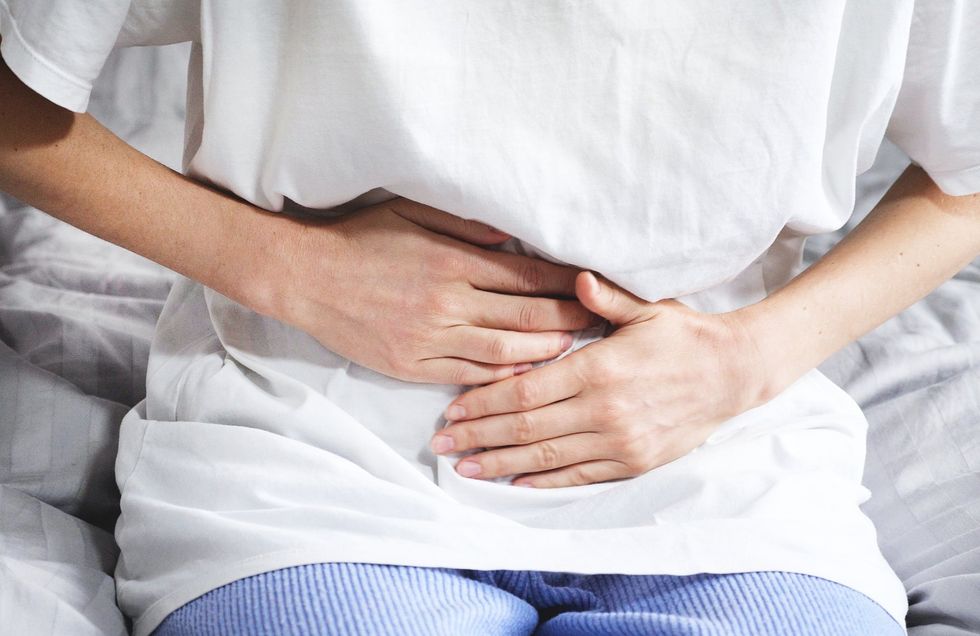 PERSON WITH STOMACH PAIN