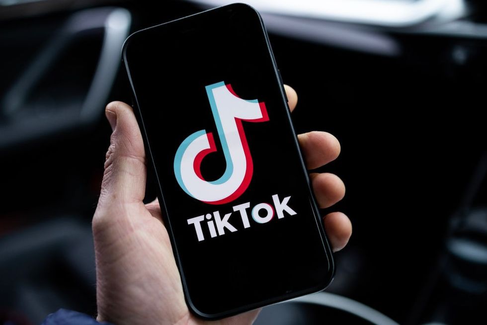 Person with TikTok on phone