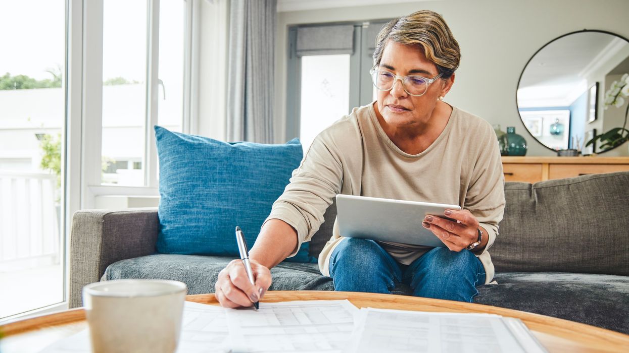 Person writing letter while planning how to reduce inheritance tax