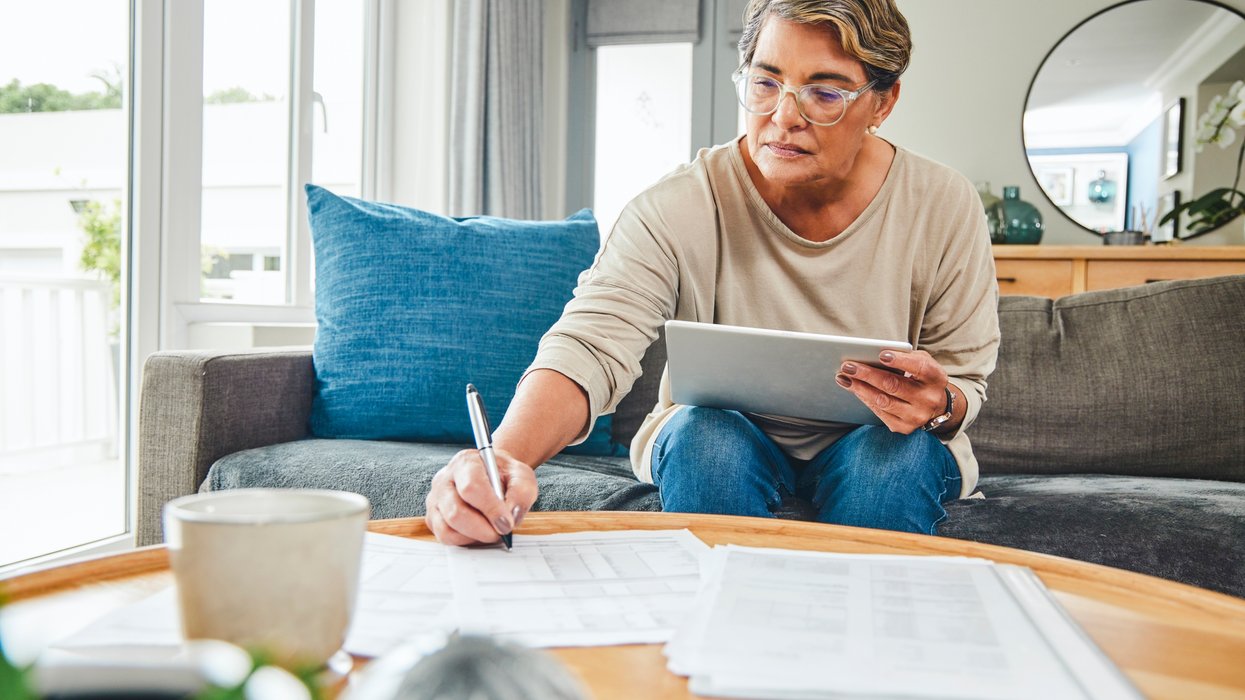 Person writing letter while planning how to reduce inheritance tax