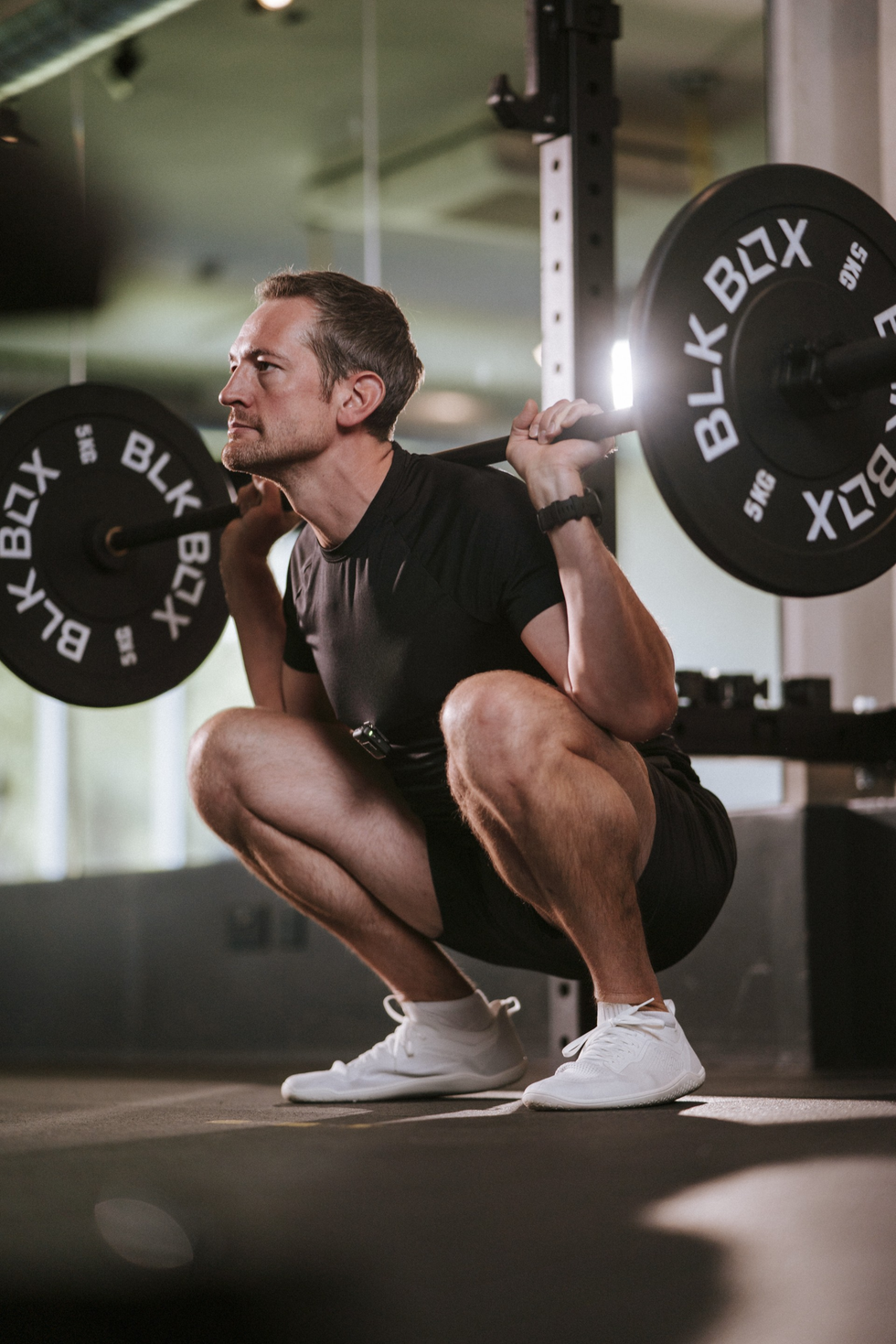 Personal Trainer Liam performing a squat