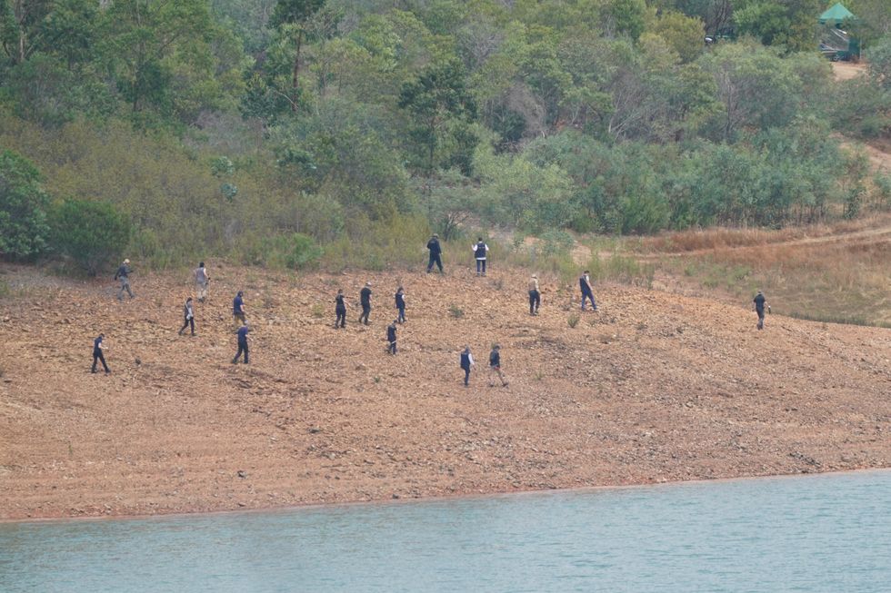 Personnel at Barragem do Arade reservoir, in the Algave, Portugal, as searches begin as part of the investigation into the disappearance of Madeleine McCann.