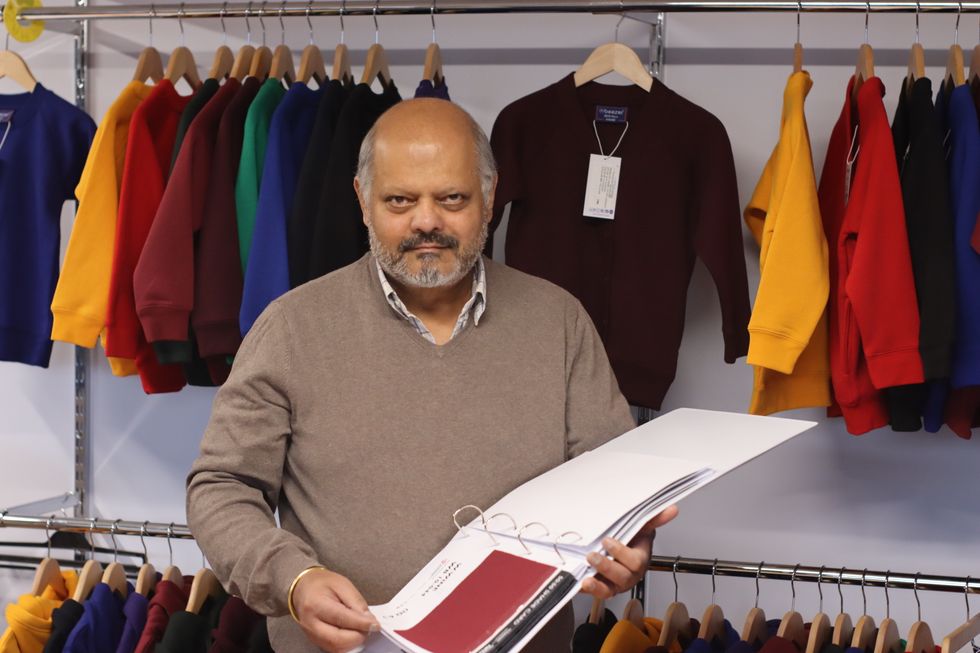 Peter Loyal holds documents
