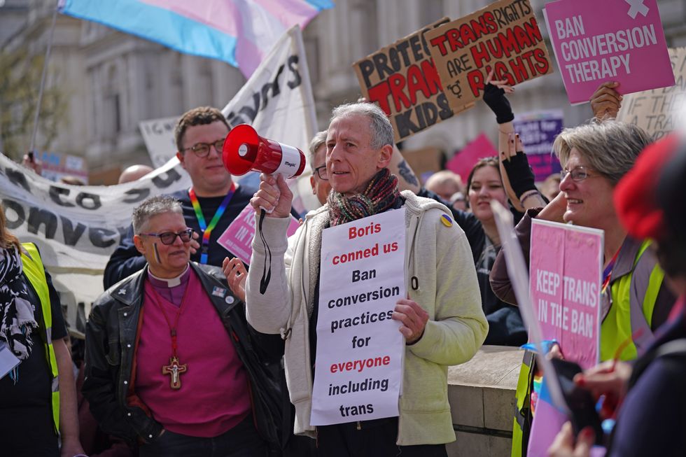 Peter Tatchell (centre) speaks during a protest outside Downing Street in London, over transgender people not being included in plans to ban conversion therapy. Picture date: Sunday April 10, 2022.