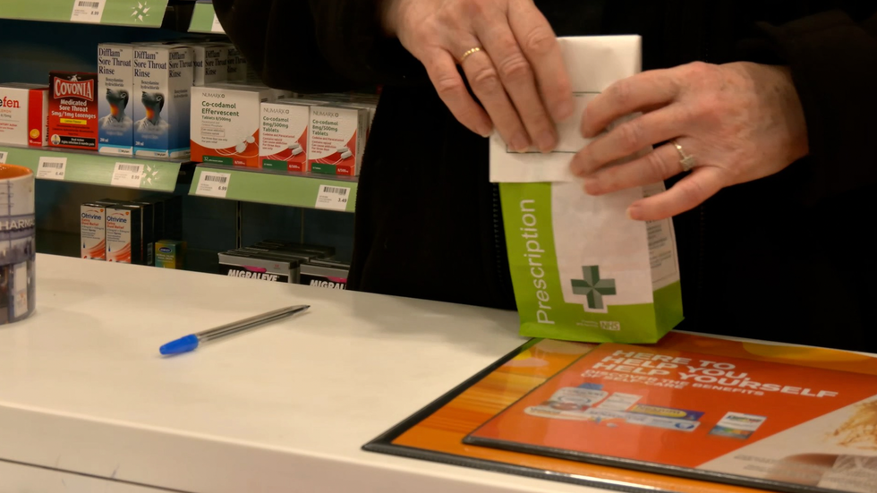 Pharmacist handling prescription