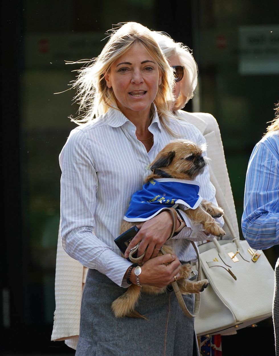Phillipa Copleston-Warren leaves Isleworth Crown Court in West London, with her support dog, where she received a three month suspended sentence, after previously admitting disclosing private sexual photographs with intent to cause distress. The 46-year-old, who used her ex-boyfriend's Alexa device to tell his new lover to get out of his bedroom has been spared jail for posting a naked picture of him on Facebook.